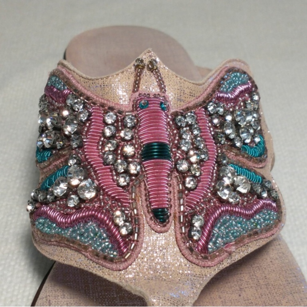 Donald Pliner sandles with colorful bead and rhinestone butterfly shaped detail.